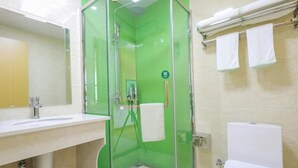 A bathroom with a glass-enclosed shower, a sink, and a toilet. - Greentree Inn Jiaxin Puyuan Kaixuan Road (Jiaxing)