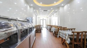 A buffet setup with multiple serving stations and tables arranged in a linear fashion. - Greentree Inn Jiaxin Puyuan Kaixuan Road (Jiaxing)