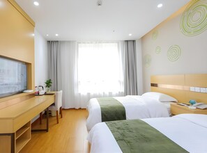 A hotel room with two beds, a desk, a television, and a window with curtains. - Greentree Inn Jiaxin Puyuan Kaixuan Road (Jiaxing)