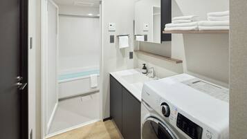 Combined shower/tub, free toiletries, hair dryer, slippers