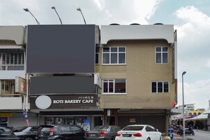 A multi-story building with a bakery cafe on the ground floor.