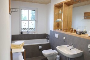 Shower, towels, soap, toilet paper