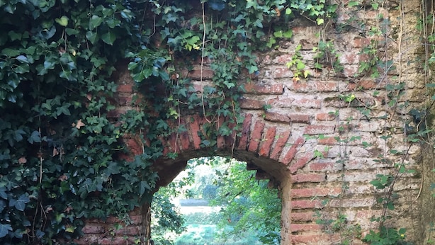An arched brick structure with a grassy path leading through it. - Gite with pool close to the pyrenees & ancient Abbey of Saint Sever de Rustan (Saint-Sever-de-Rustan)