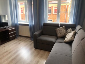Apartamento conforto | Área de estar | TV de tela plana