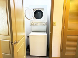 A compact laundry room with a washing machine and dryer.