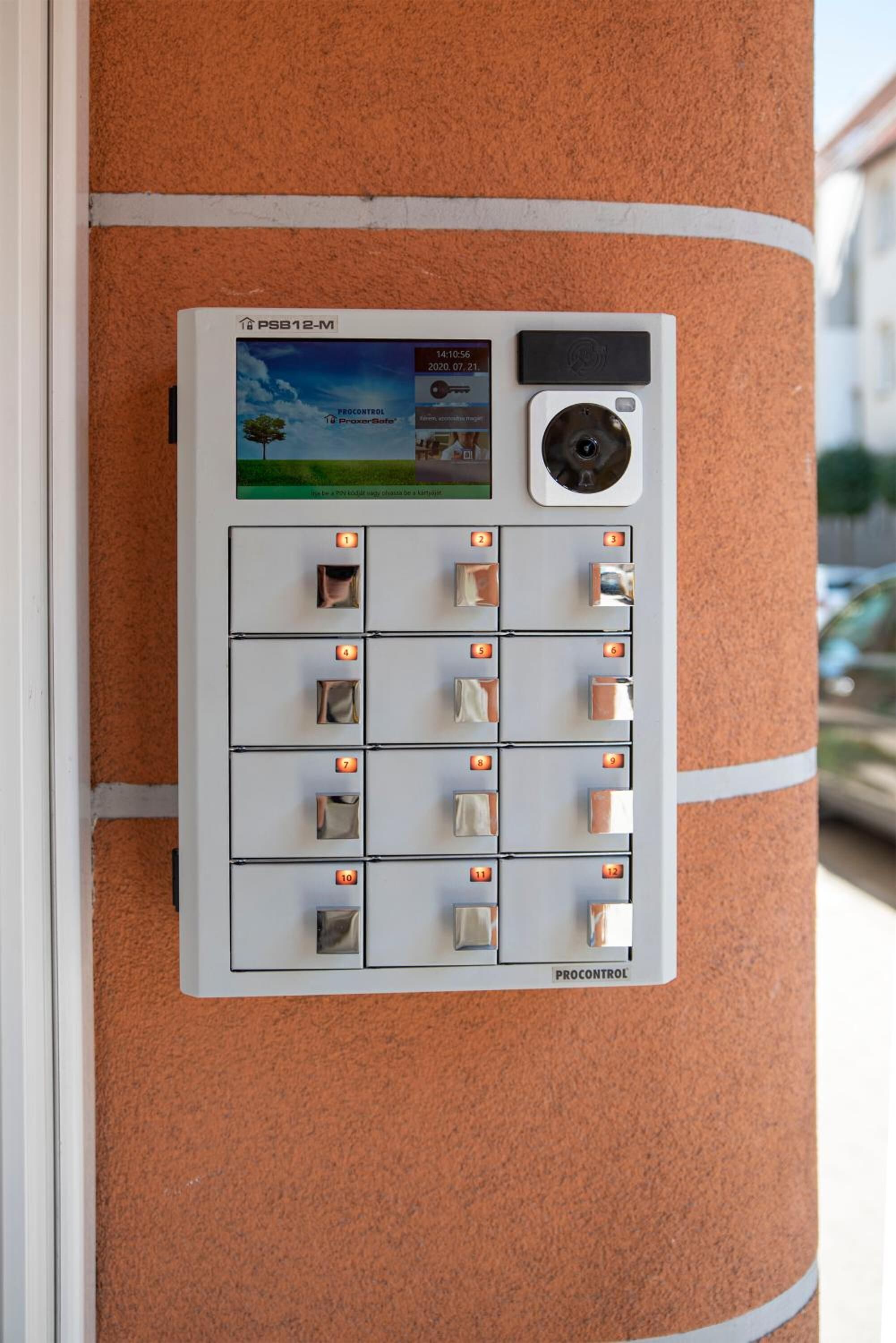 A ProControl Proxess Control panel with numbered slots, a digital display, and a camera.