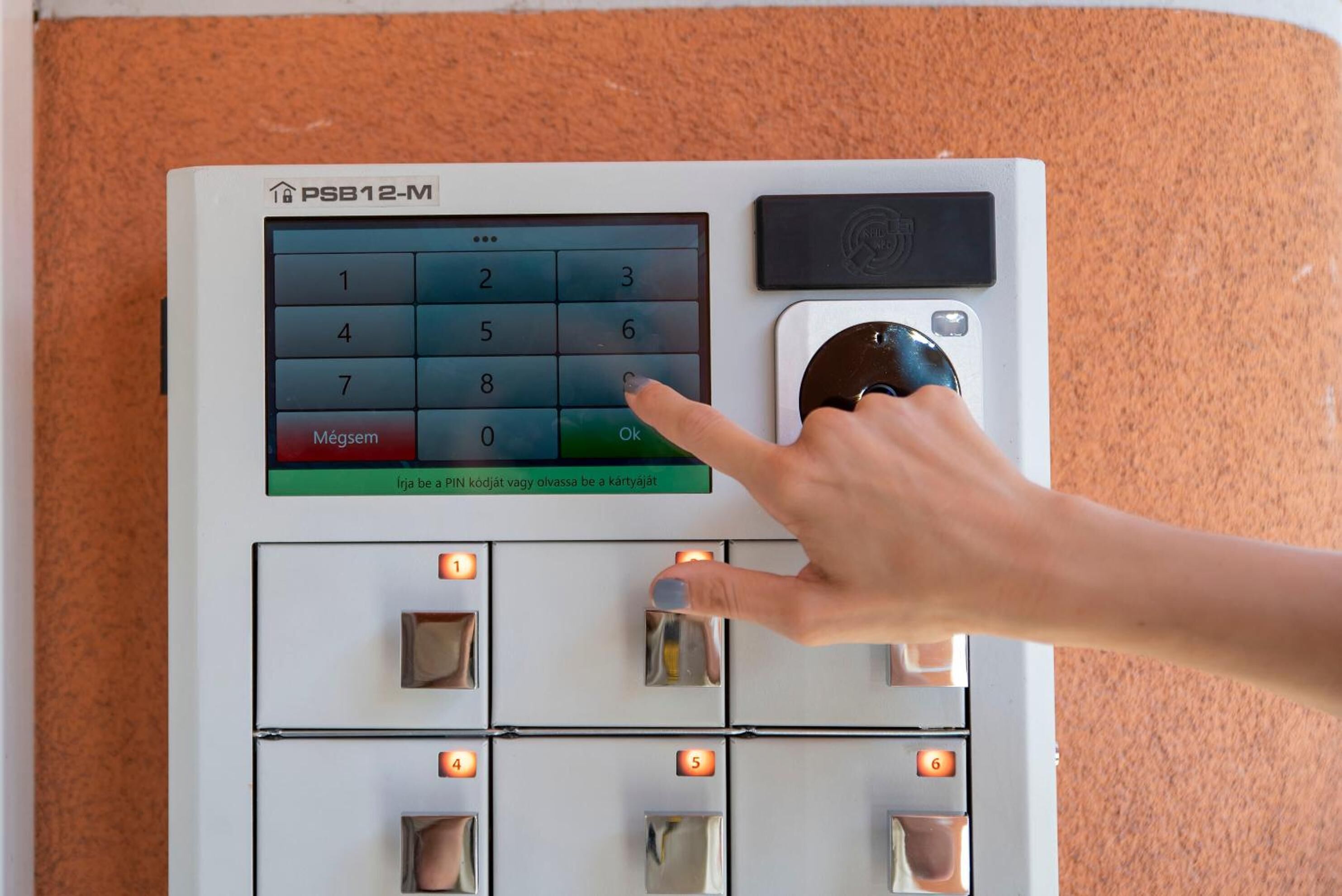 A control panel with a keypad and buttons, likely for room access or security.