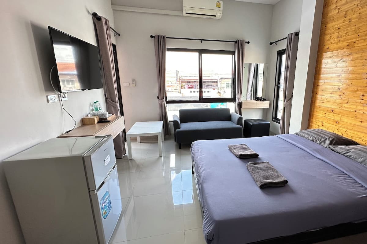 Habitación Deluxe | Cortinas blackout, wifi gratis y ropa de cama