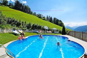 Seasonal outdoor pool, pool umbrellas, pool loungers