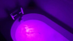 A bathtub with a purple light. - CMK Bar & Spa (Milton Keynes)
