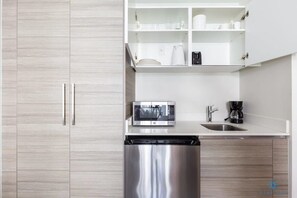 Microwave, coffee/tea maker, toaster, cookware/dishes/utensils