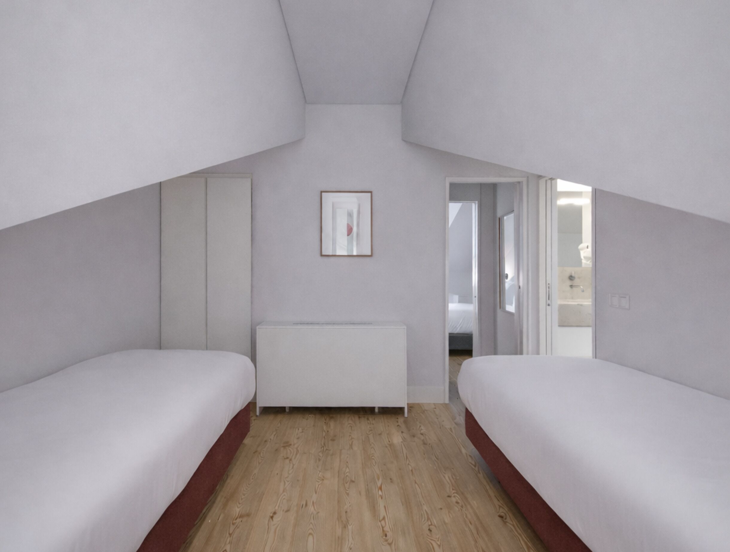 Una camera da letto con letti a castello, un termosifone e un quadro appeso al muro.