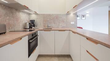 Deluxe Apartment, 1 Bedroom | Private kitchen | Microwave, stovetop, coffee/tea maker, electric kettle