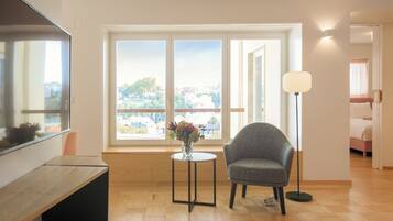 Deluxe Apartment, 1 Bedroom | Living area | 32-inch LCD TV with cable channels, TV