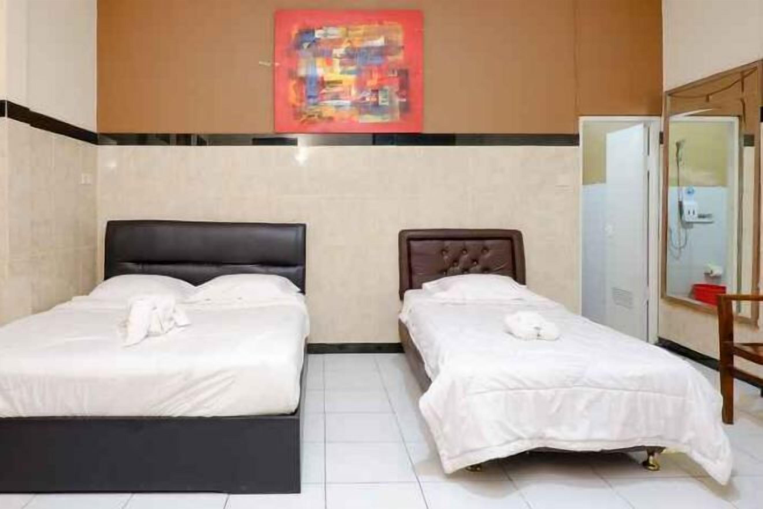 Meja kerja, tempat tidur lipat/tambahan, Wi-Fi gratis, dan seprai linen