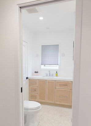 Shower, hair dryer, towels, toilet paper