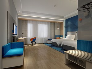 A modern hotel room with a bed, a desk, a chair, and a television. - Holiday Inn Express Horgos by IHG (Huocheng County)