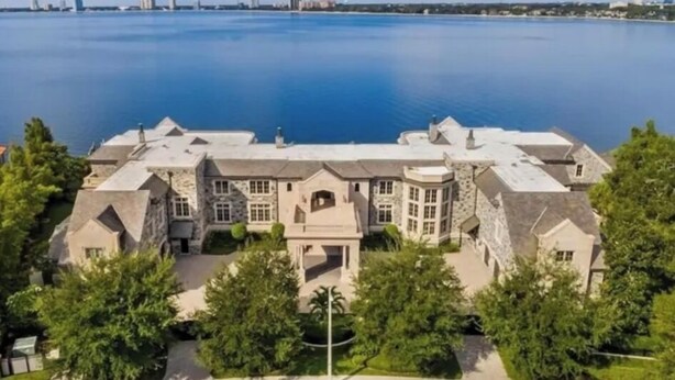 A large, multi-story stone building with a symmetrical facade, a central entrance, and a surrounding landscaped area. - Davis Islands Urban Fiesta 2 Bedroom (Tampa)