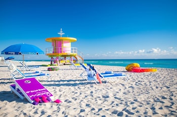 Beach nearby, white sand, sun loungers at Moxy Miami South Beach