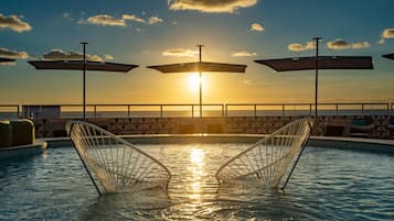 2 outdoor pools, pool umbrellas, pool loungers