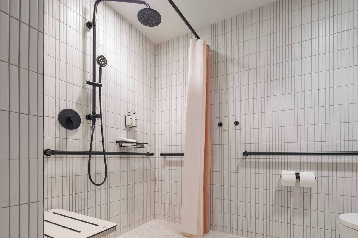 shower, rainfall showerhead, hair dryer, towels