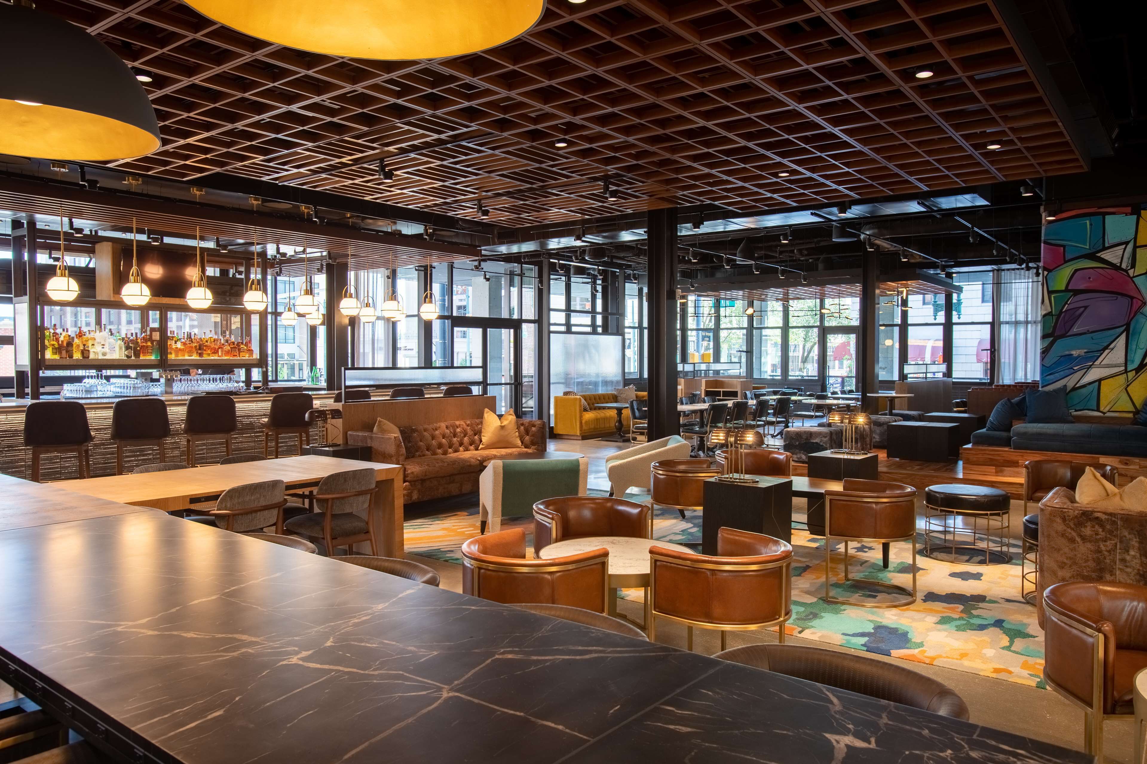 A modern bar area with seating and a bar counter.