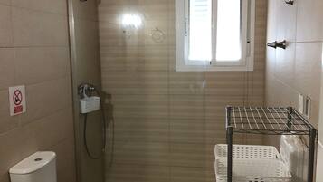 Shower, hair dryer, towels, toilet paper
