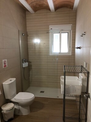 Shower, hair dryer, towels, toilet paper
