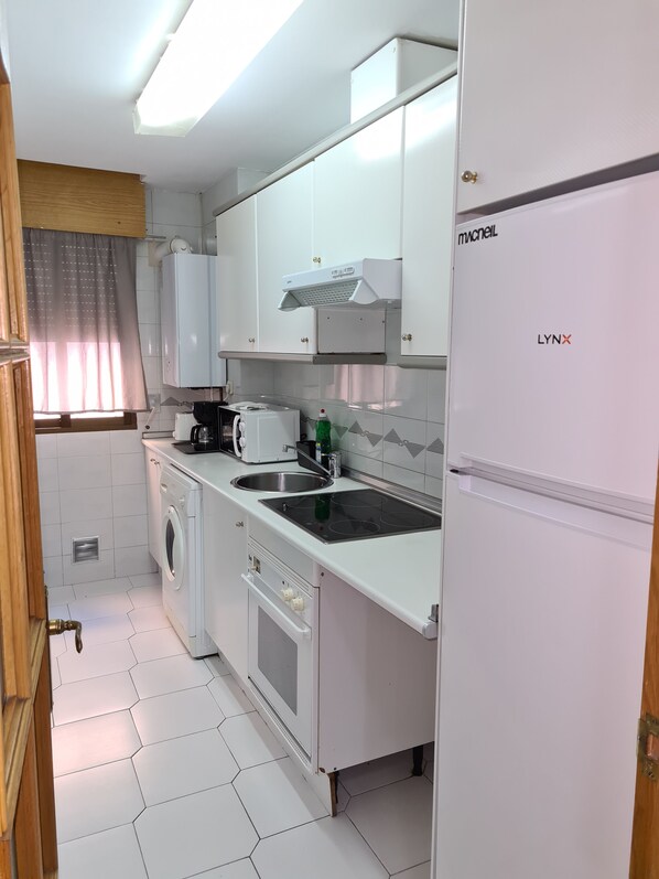 Microwave, stovetop, coffee/tea maker, electric kettle