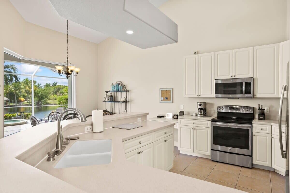 Fridge, microwave, coffee/tea maker, cookware/dishes/utensils