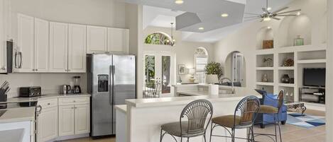 Fridge, microwave, coffee/tea maker, cookware/dishes/utensils