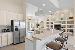 Fridge, microwave, coffee/tea maker, cookware/dishes/utensils