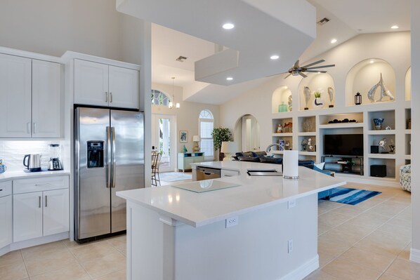 Fridge, microwave, coffee/tea maker, cookware/dishes/utensils