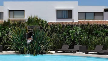 Outdoor pool, open 9:30 AM to 8:00 PM, pool umbrellas, pool loungers