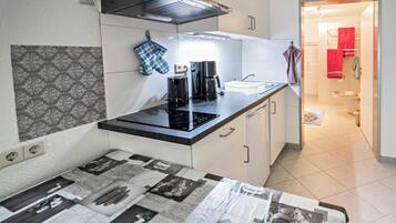 Fridge, microwave, stovetop, coffee/tea maker