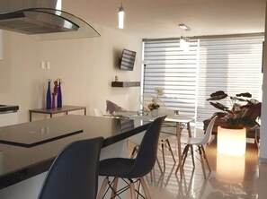 Fridge, microwave, stovetop, coffee/tea maker