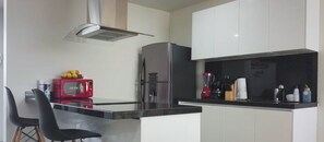 Fridge, microwave, stovetop, coffee/tea maker