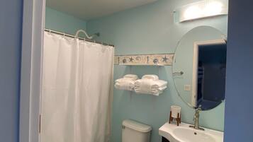 Combined shower/bathtub, hair dryer, towels, soap