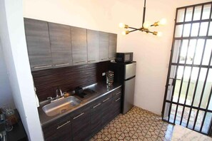 Fridge, microwave, stovetop, coffee/tea maker