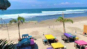 On the beach, black sand, surfing