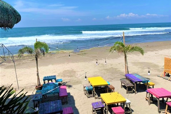 On the beach, black sand, surfing