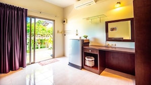 A modern bathroom with a shower, a sink, and a mirror. - Muchshima House (Choeng Thale)