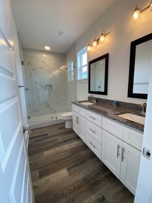 Combined shower/tub, hair dryer, towels, soap