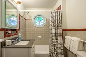 Bathtub, hair dryer, towels