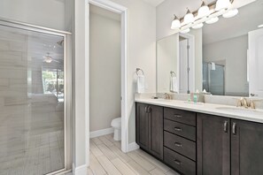 Bathtub, hair dryer, towels, soap