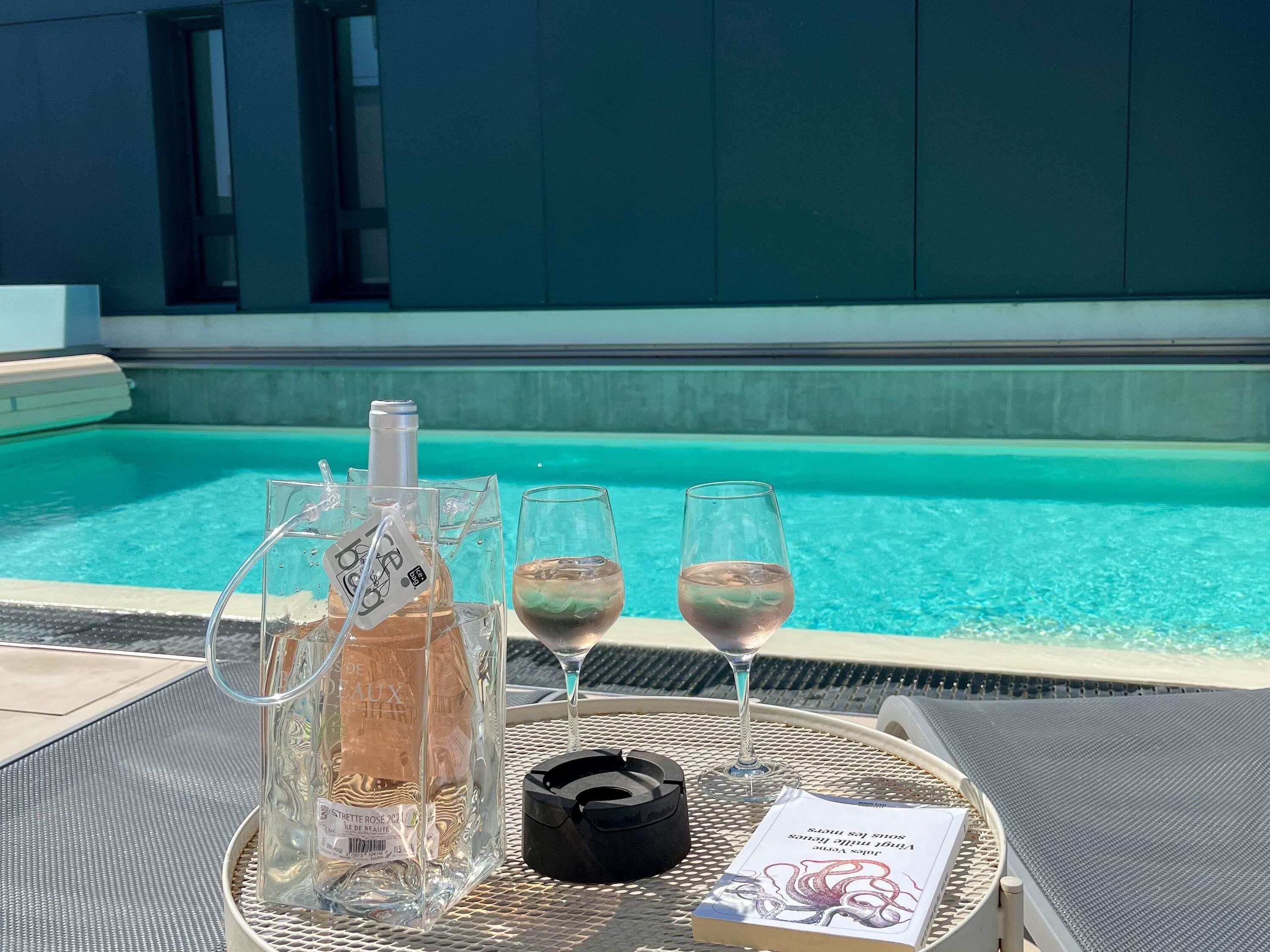 Seasonal outdoor pool, open 10:00 AM to 9:00 PM, pool umbrellas