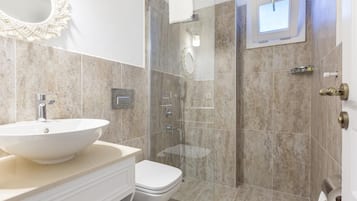 Shower, hair dryer, slippers, towels
