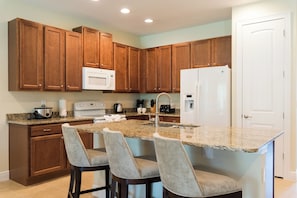 Fridge, microwave, oven, stovetop - Welcoming Home with Private Pool near Disney with WaterPark & Resort Access at. (Reunion)