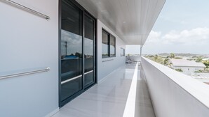 A modern balcony with a view of the cityscape. - Gray Door Apartments - Adults Only (Noord)