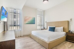 1 bedroom, desk, iron/ironing board, travel crib